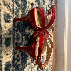 Red patent leather slingback pumps